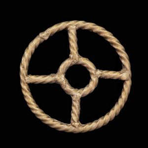 Late iron age gold, silver and copper alloy amulet