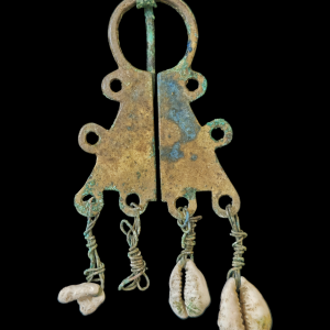 Viking period bronze omega fibula with shell pendants
