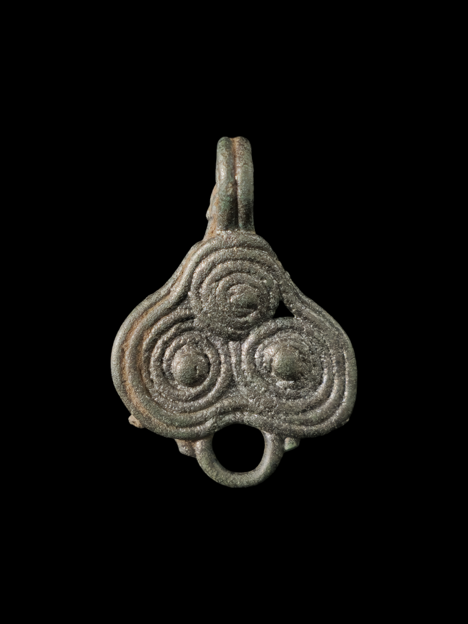 Viking period white bronze pendant with triskelion