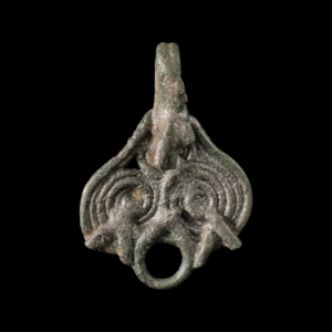 Viking period white bronze pendant with triskelion