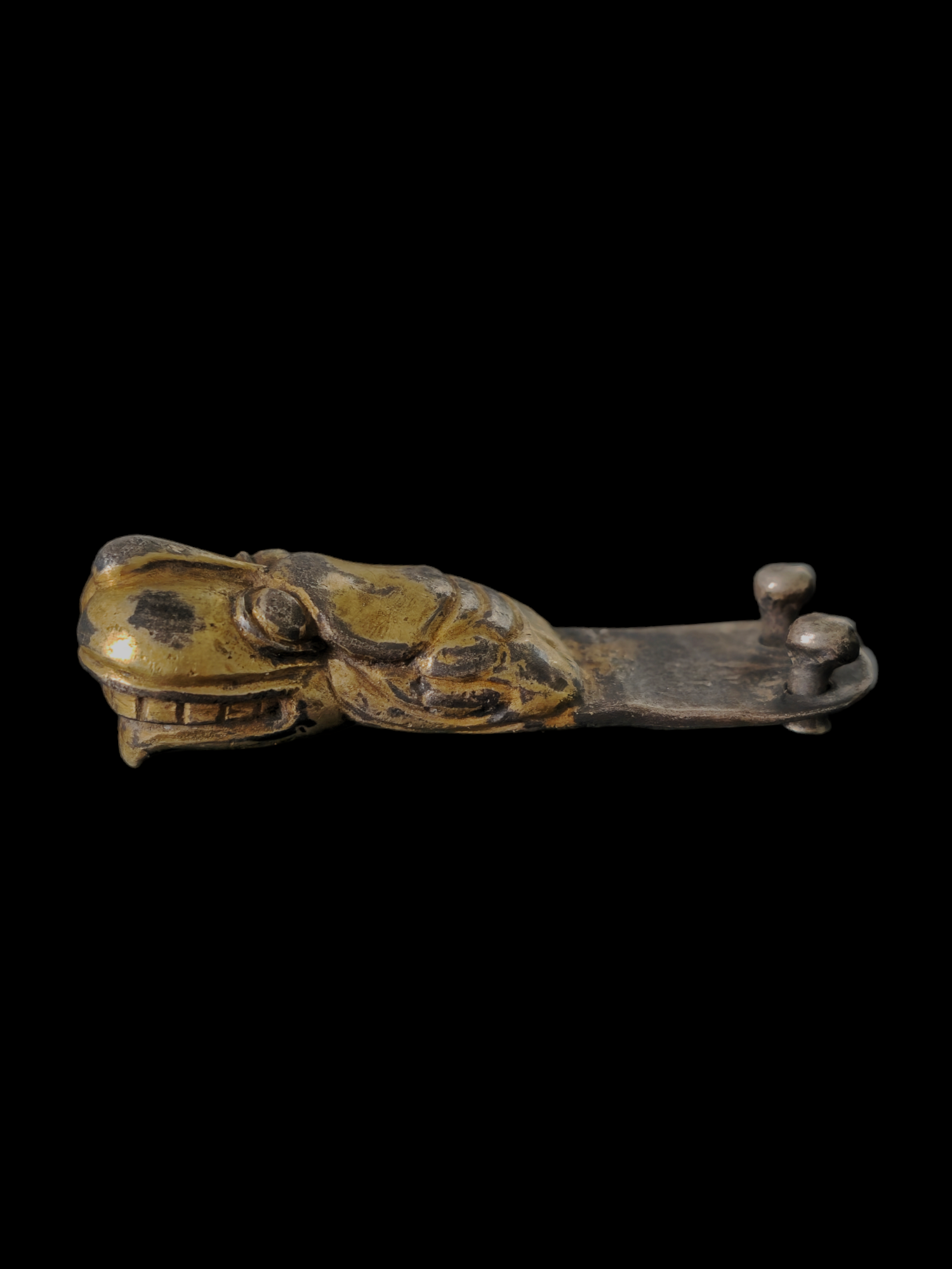 Medieval gilded silver lion head belt strap end